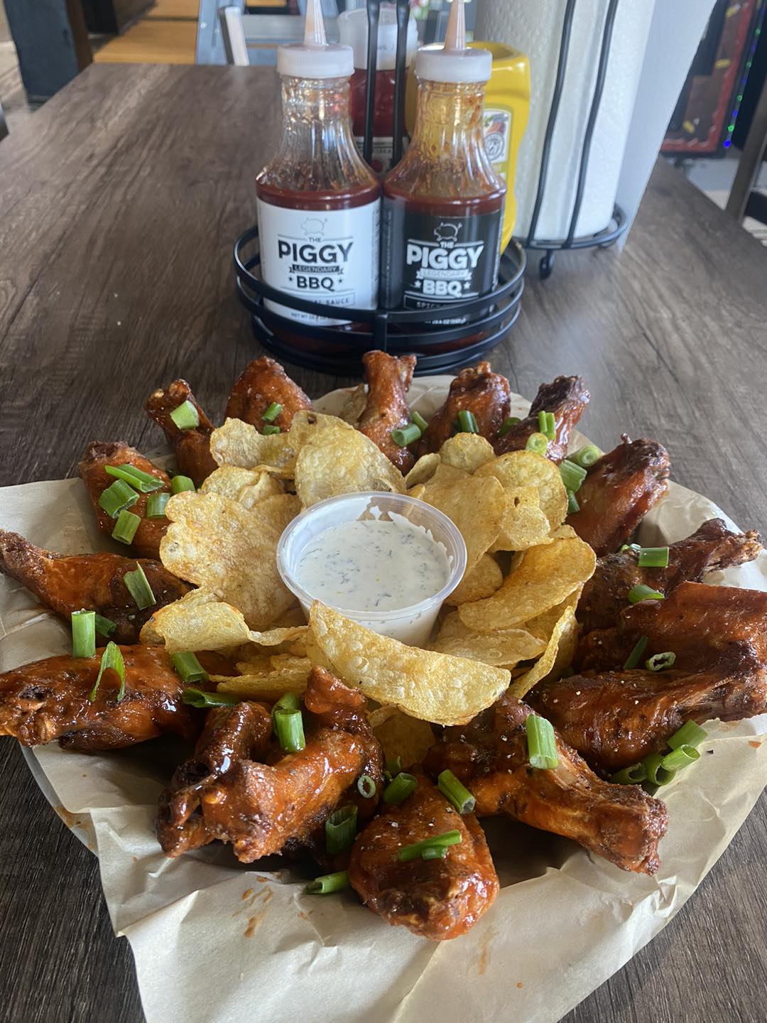 Platter of wings with chips and dip at the piggy bbq